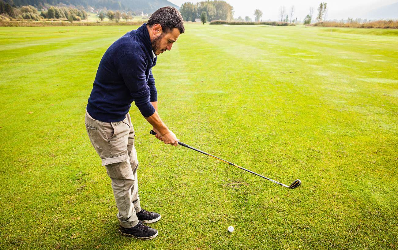 Golf Foot Placement - Your Foot Position for Golf Explained 2 a golfer sets up for a shot