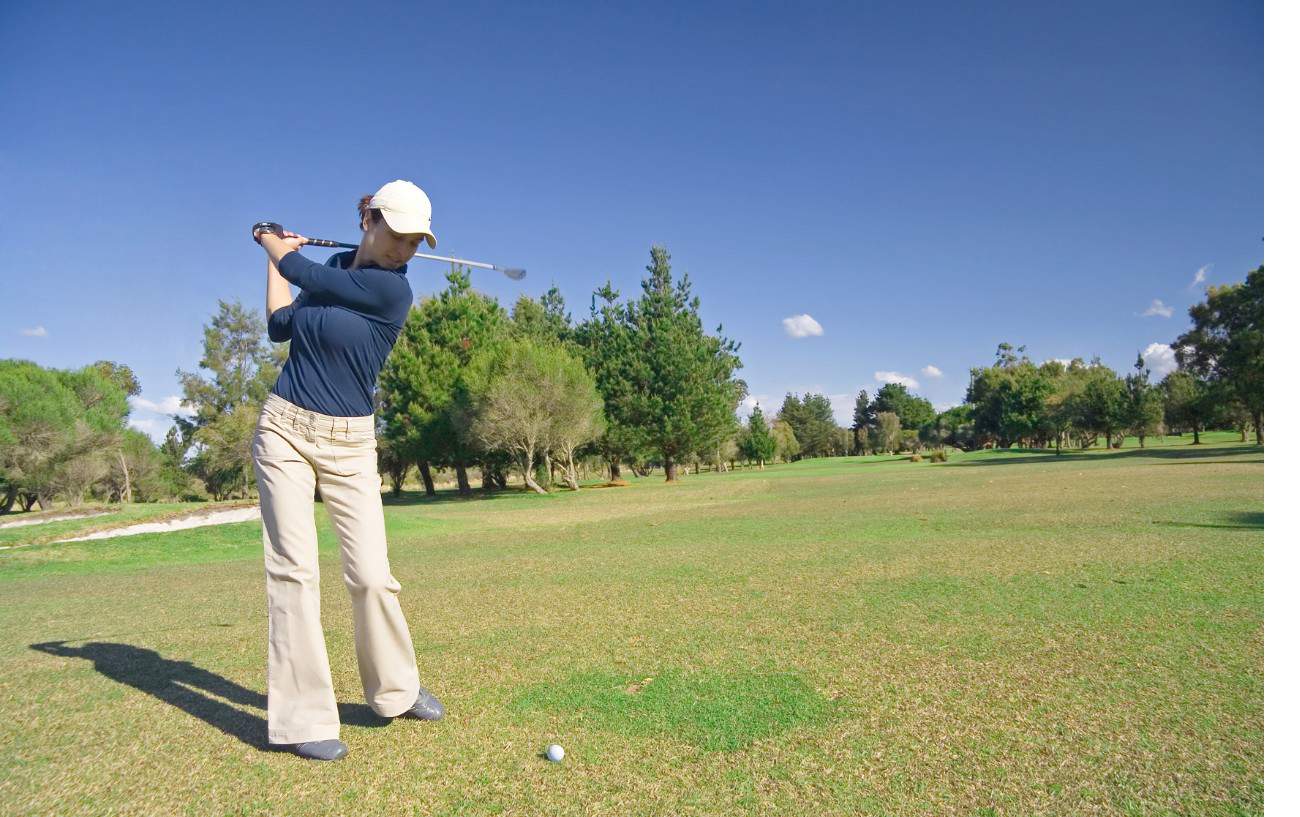 How To Maintain Spine Angle In Your Golf Swing: 5 Expert Tips 2 A golfer prepares to make a swing.